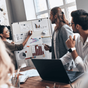 Employees discussing open vs. closed innovation in the office.